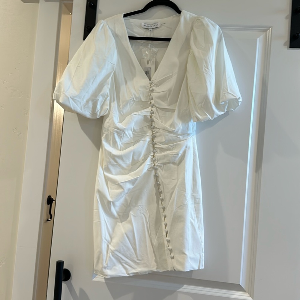 Asymmetrical buttoned puff sleeve fitted mini